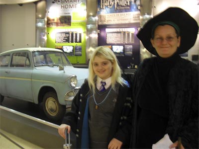 My daughter and I in front of the flying car at the<br>Museum of Science and Industry<br>Chicago